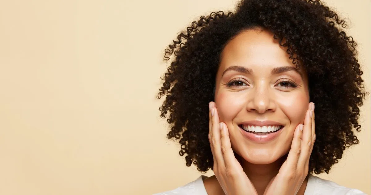 Woman with healthy, glowing skin showing the results of using the right skincare products and a consistent routine.